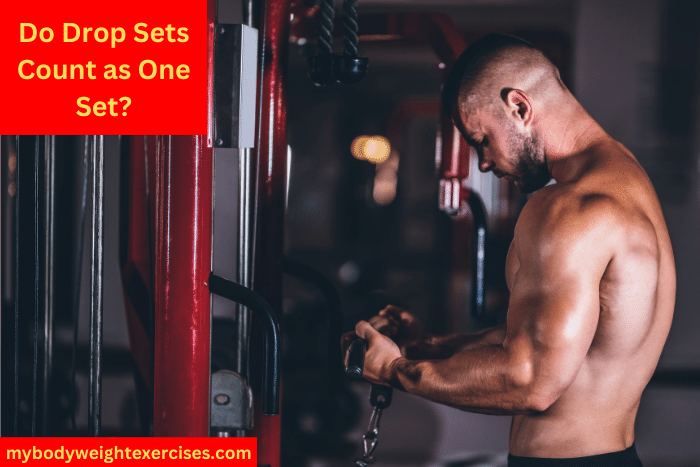 A Muscular Man Performing Cable Bicep Curls