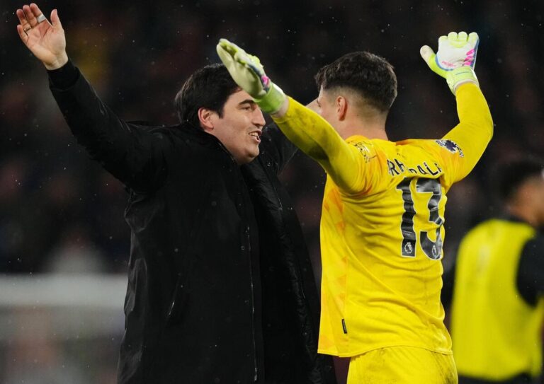 Bournemouth goalkeeper Kepa Arrizabalaga celebrates with manager Andoni Iraola