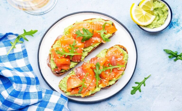 A plate of 2 avocado and salmon toasts as a delicious breakfast with 30g of protein